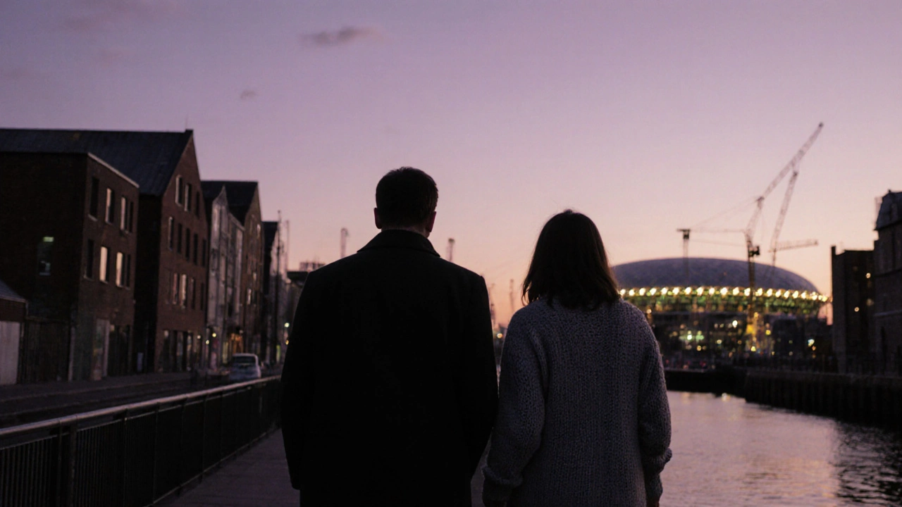 Two silhouettes walking peacefully along the Thames Path at sunset in East London.