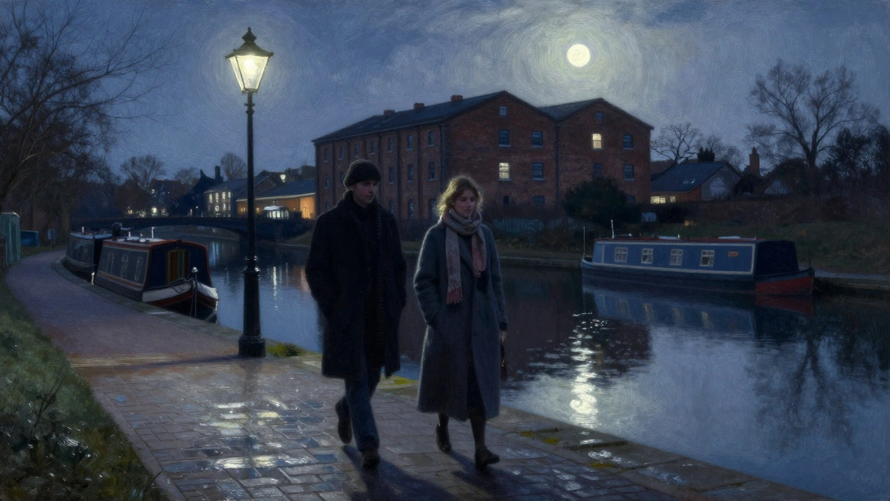 Two figures stroll along a canal at night, illuminated by soft gas lamps and water reflections.
