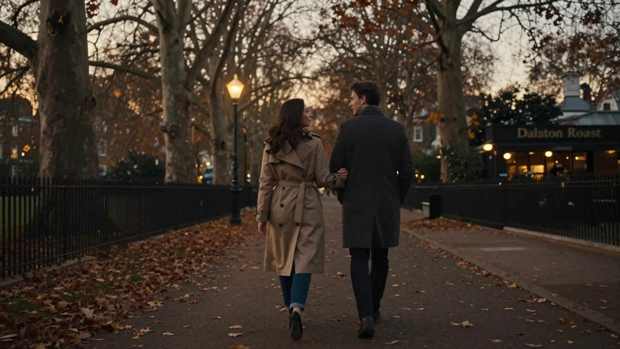 Two people walking peacefully through Victoria Park at dusk, lost in quiet companionship.