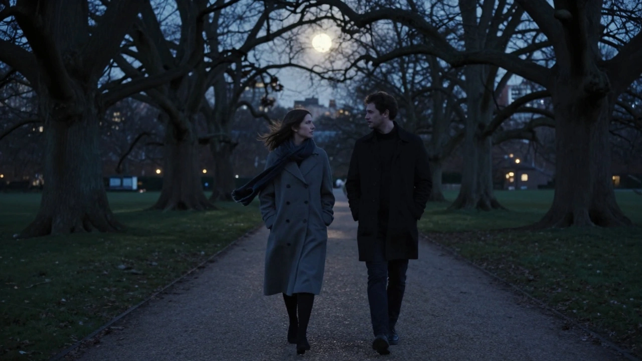Two silhouettes walking peacefully through Hyde Park at twilight, surrounded by trees and the calm of dusk.
