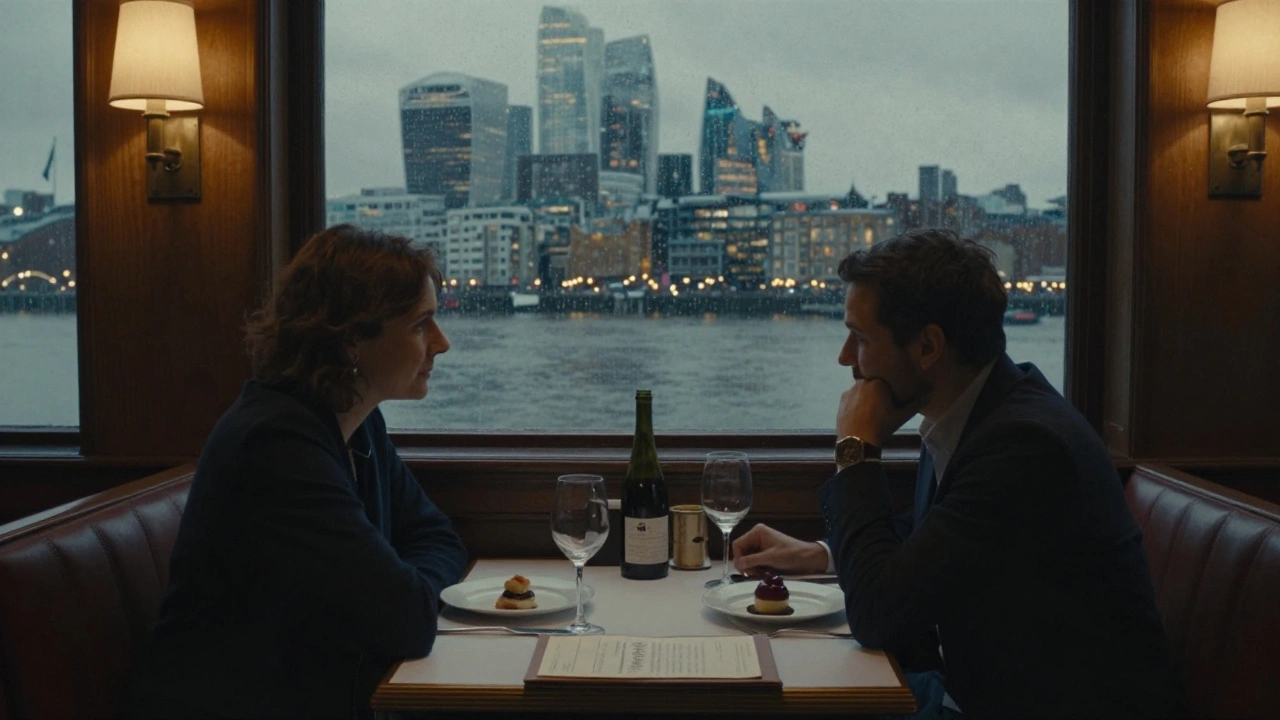 Intimate dinner by a window at Greenwich Tavern with river lights and rain-streaked glass.