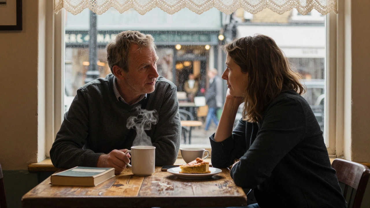 Two people talk warmly in a cozy Walthamstow café, steam rising from mugs, no phones, natural light filtering through curtains.